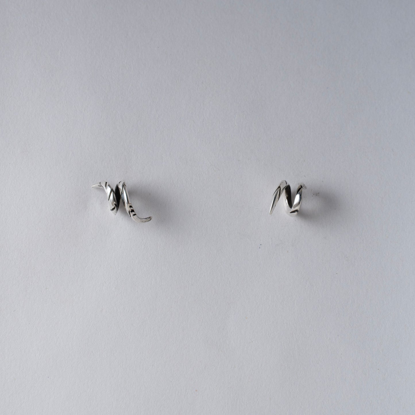 Handmade Asymmetrical Oxidized and Mirror Polish Sterling Silver Spiral Horn Stud Earrings — Artisan Jewelry