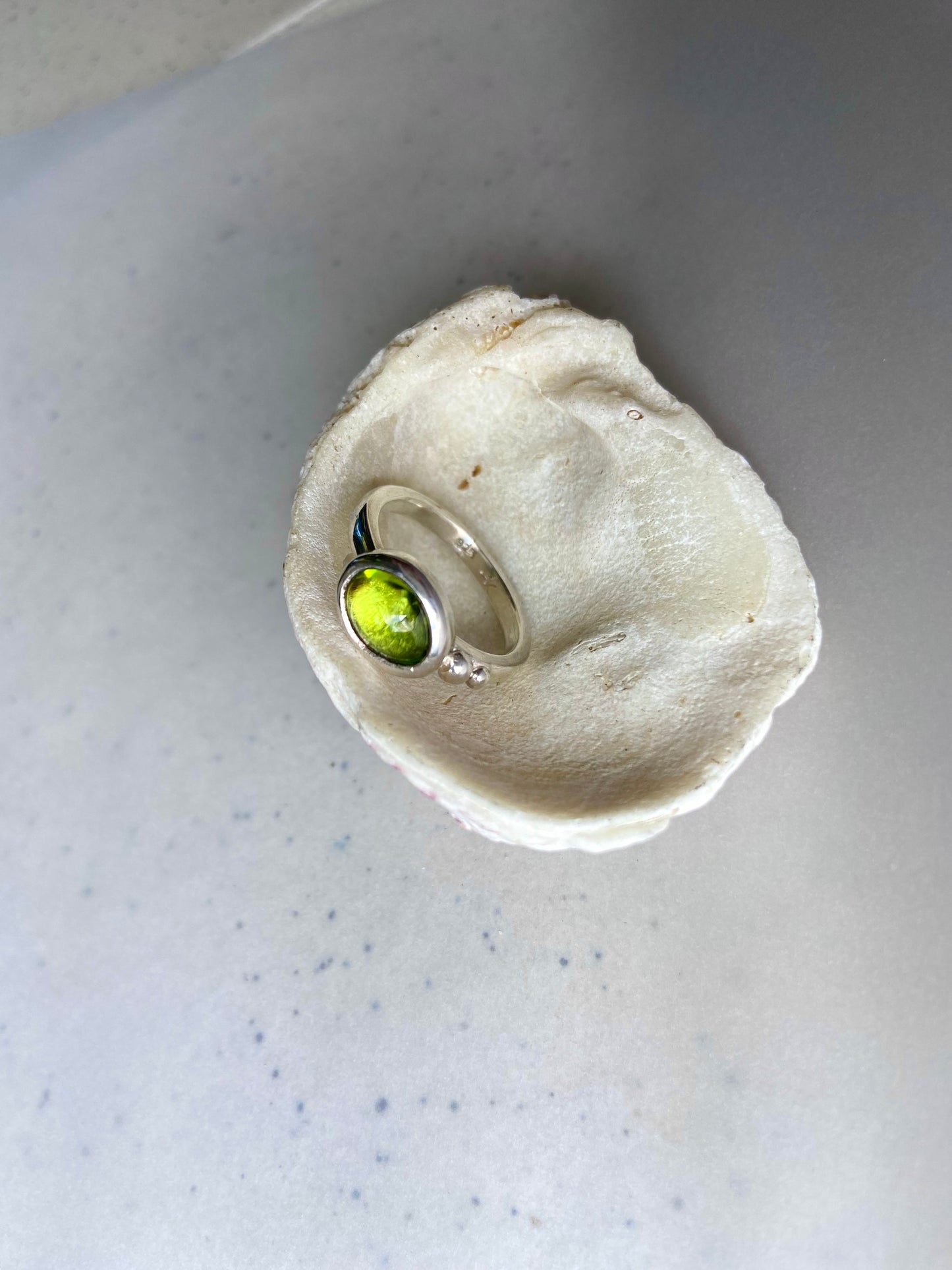 Exquisite Tanzanian peridot handcrafted in a timeless silver ring