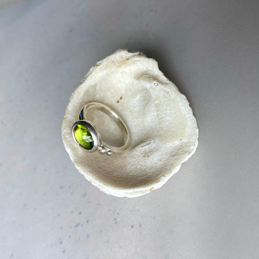 Exquisite Tanzanian peridot handcrafted in a timeless silver ring