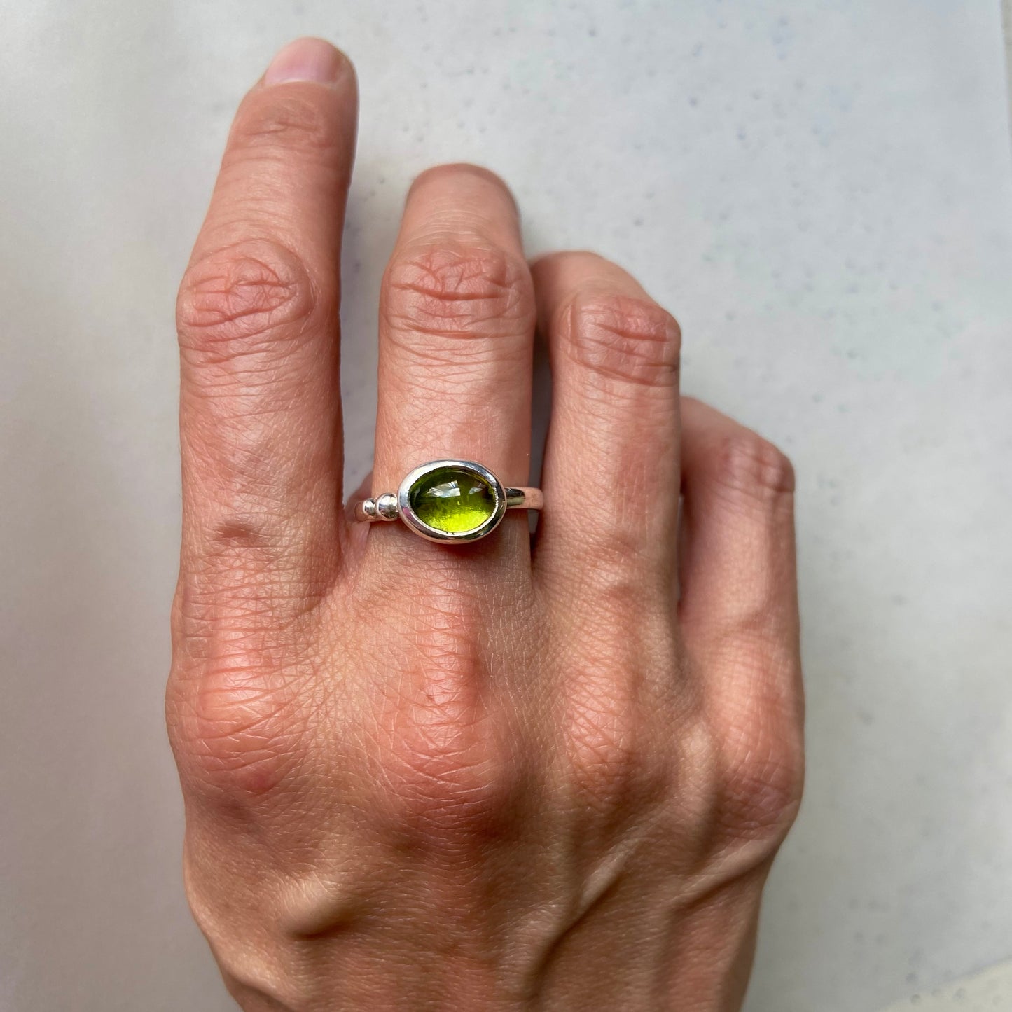 Exquisite Tanzanian peridot handcrafted in a timeless silver ring