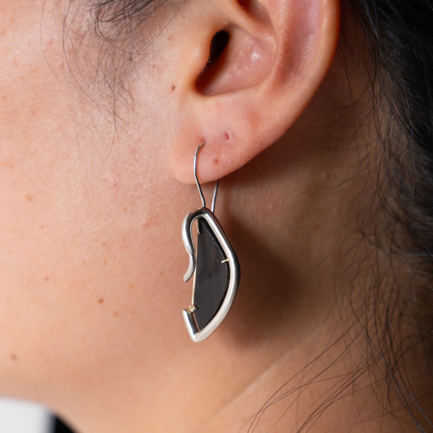 Pronghorn earrings in silver, hand fabricated in sterling silver with ebony wood hand set in 14k yellow gold dangle earrings