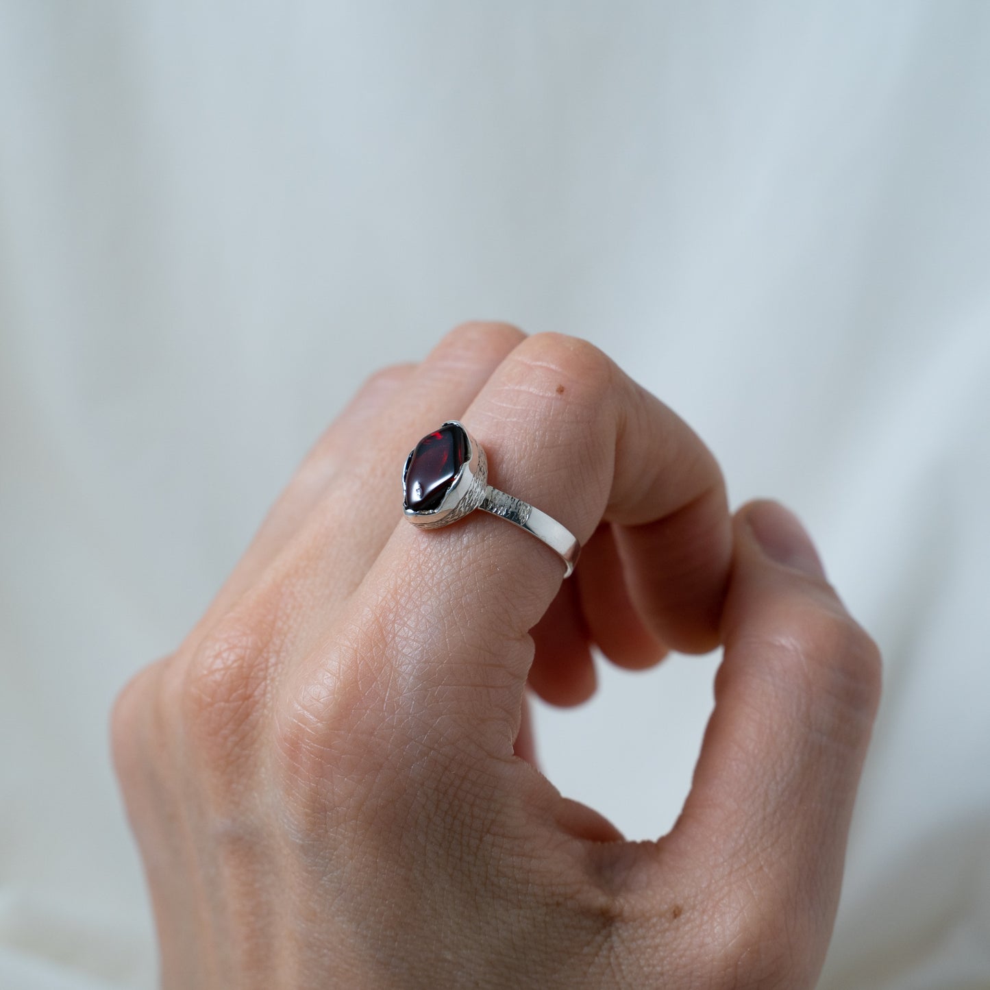 Textured, silver, garnet cabochon ring