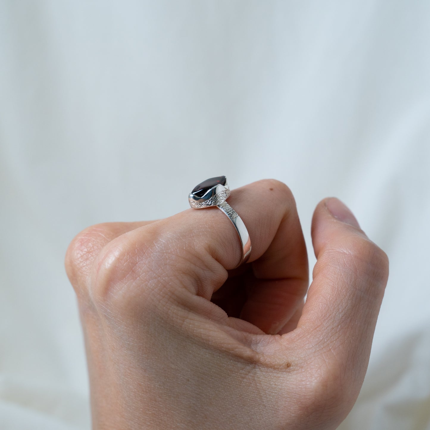 Textured, silver, garnet cabochon ring