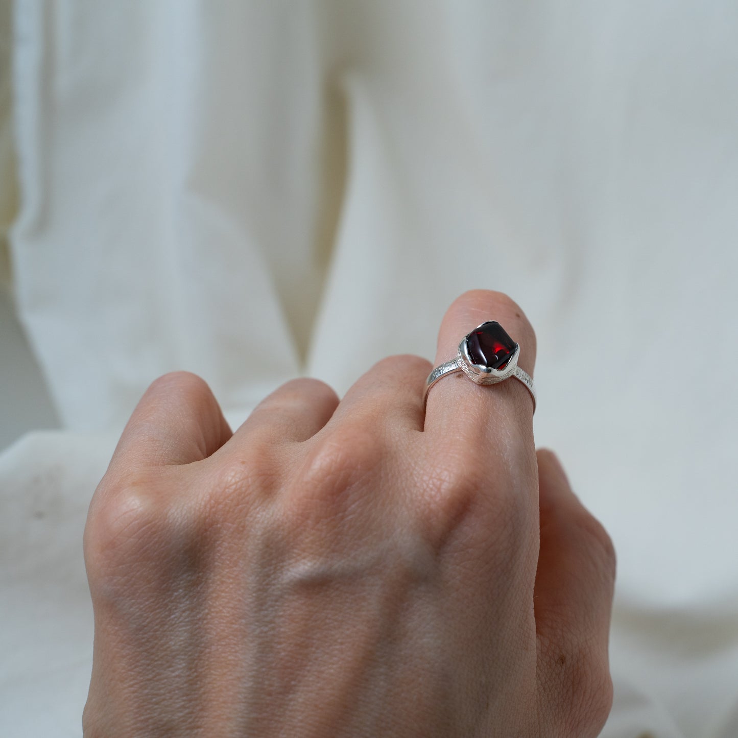Textured, silver, garnet cabochon ring