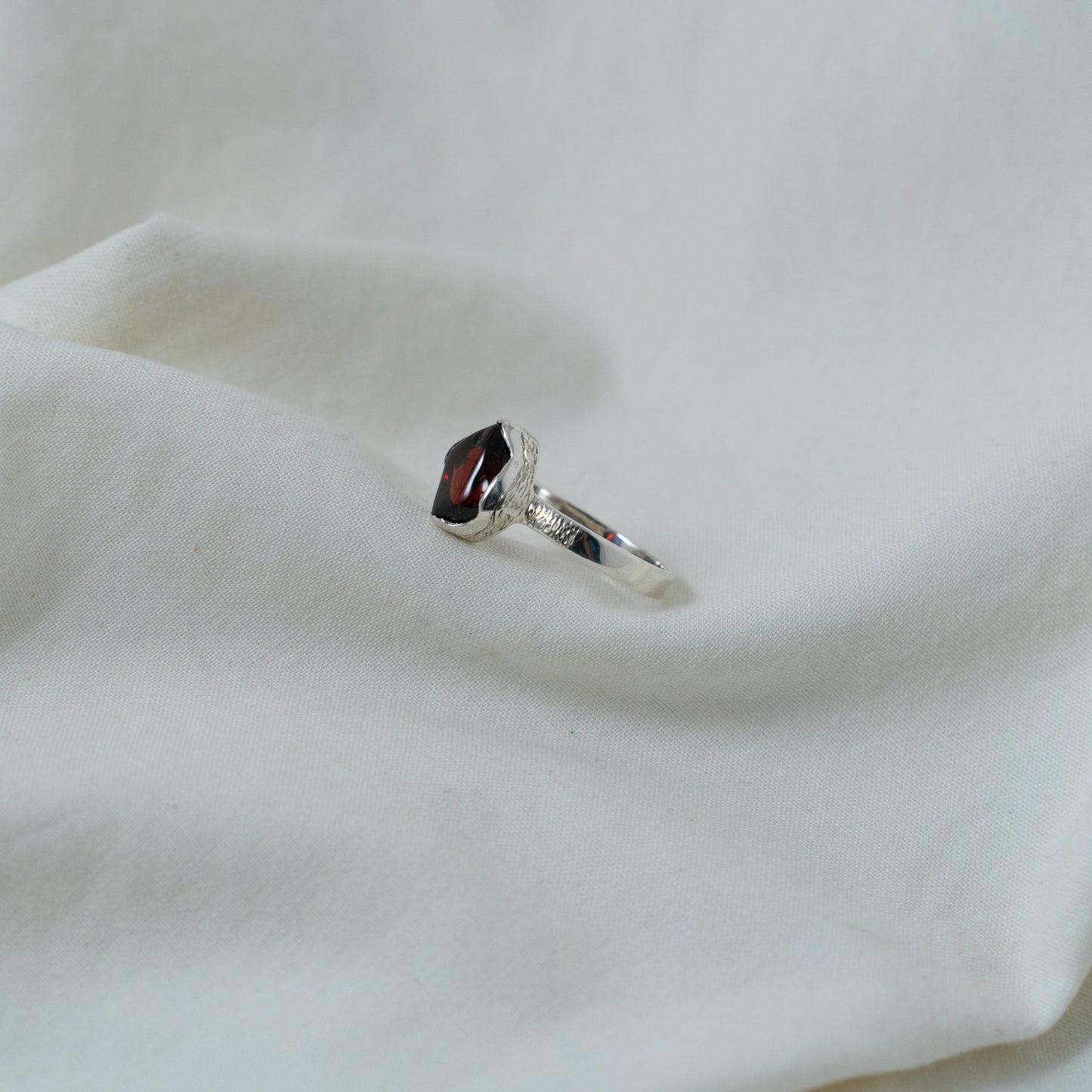 Textured, silver, garnet cabochon ring