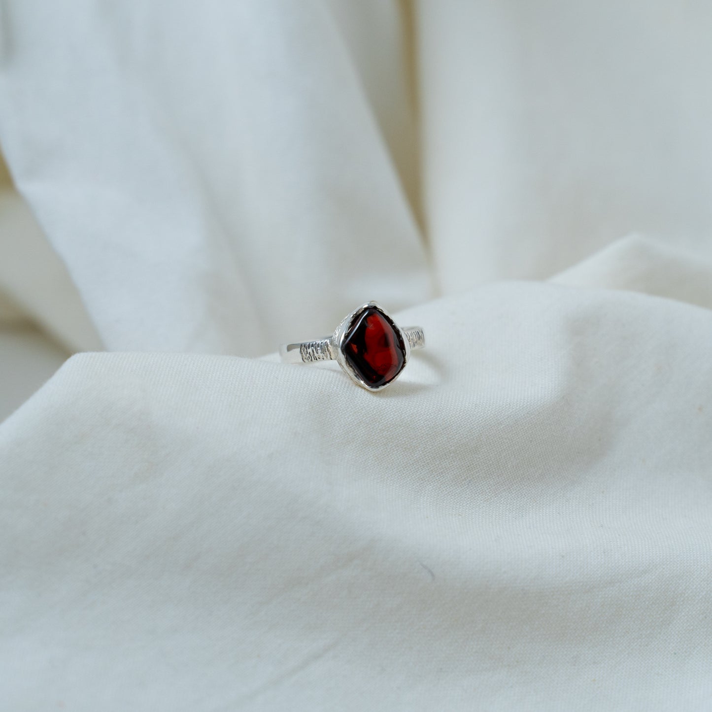 Textured, silver, garnet cabochon ring