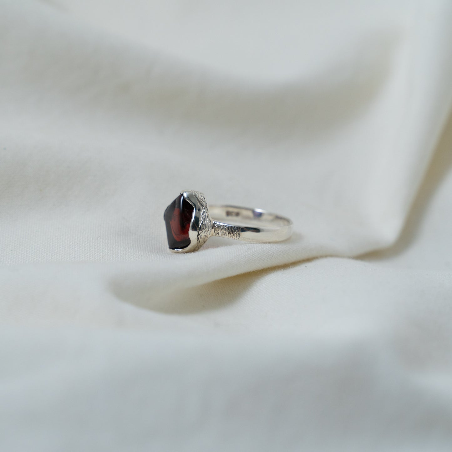 Textured, silver, garnet cabochon ring