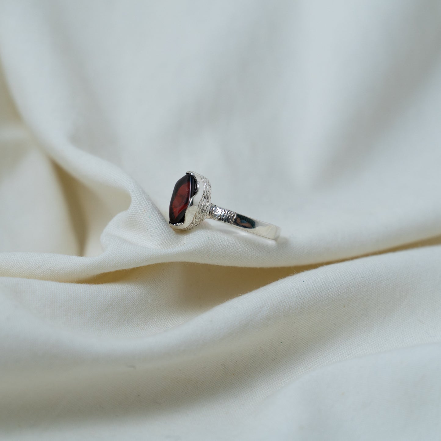 Textured, silver, garnet cabochon ring