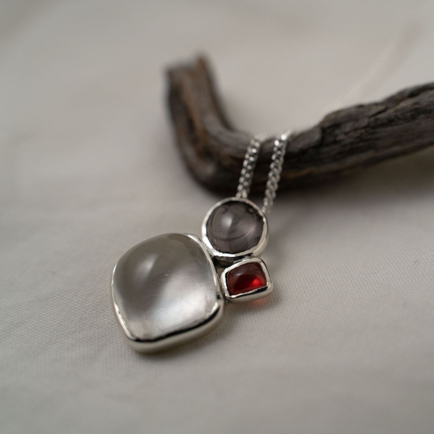 quartz, smokey quartz and garnet silver pendant