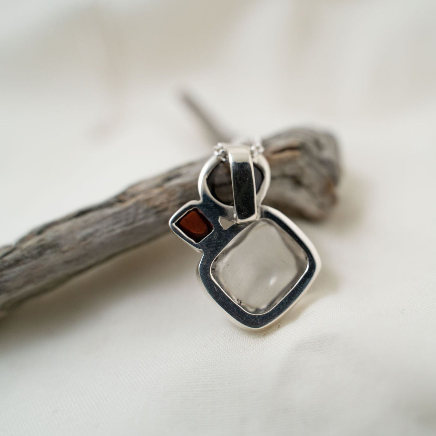 quartz, smokey quartz and garnet silver pendant