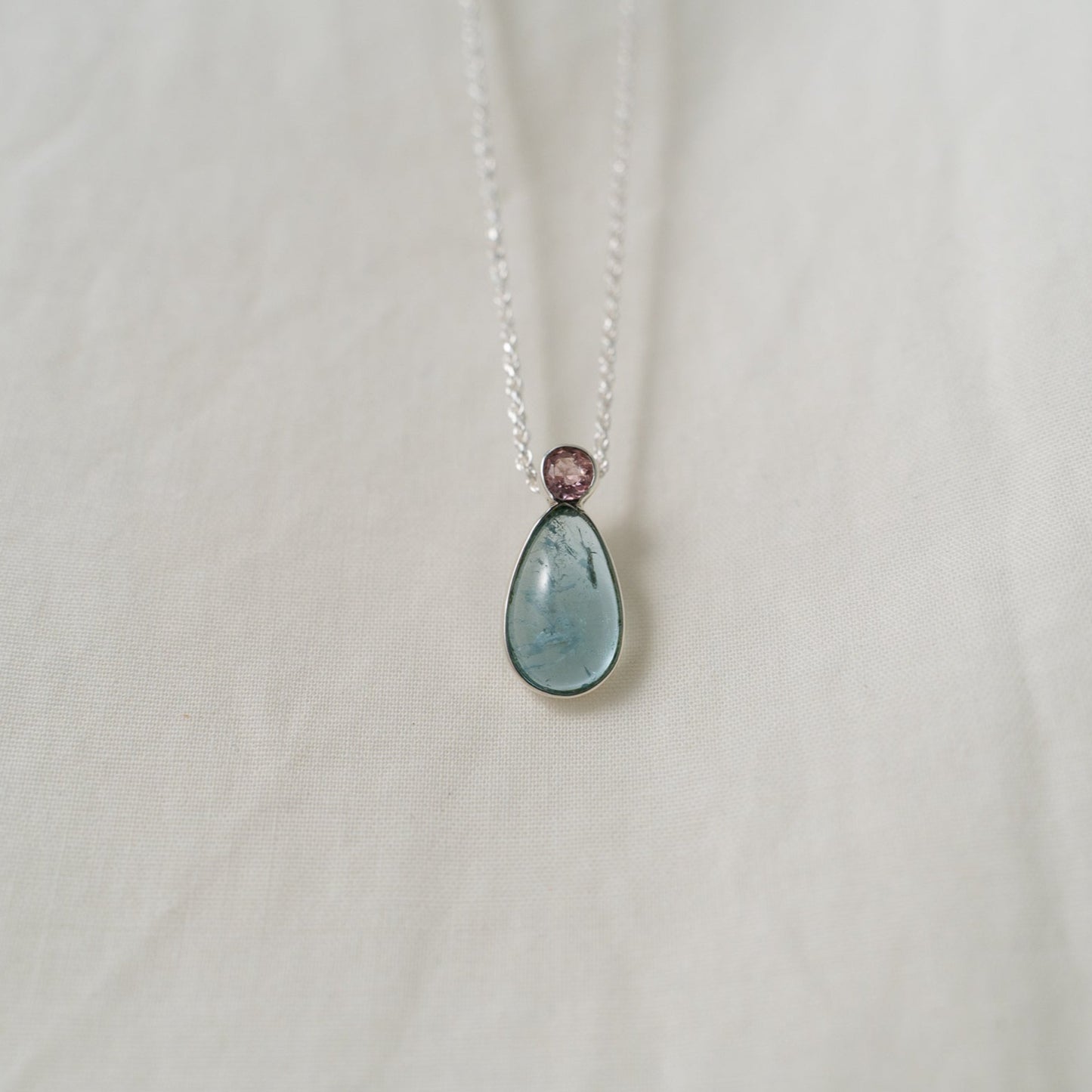 Teardrop aquamarine with faceted pink tourmaline silver pendant