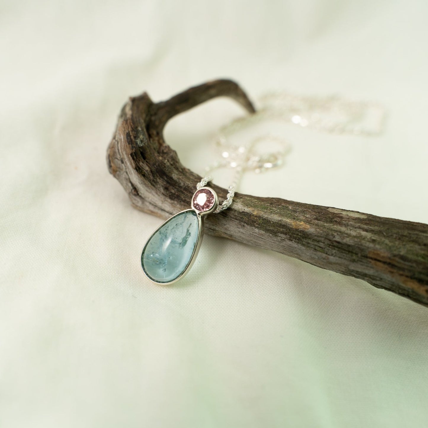 Teardrop aquamarine with faceted pink tourmaline silver pendant