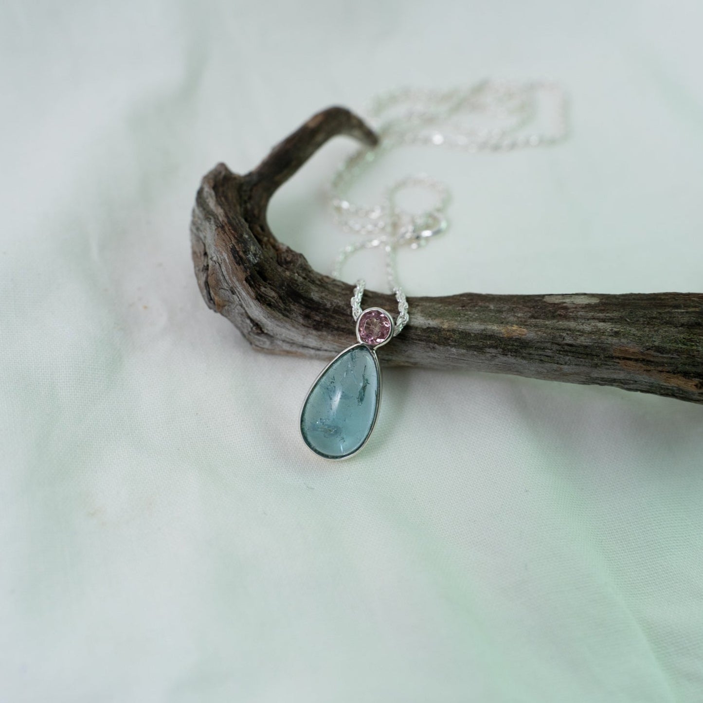 Teardrop aquamarine with faceted pink tourmaline silver pendant