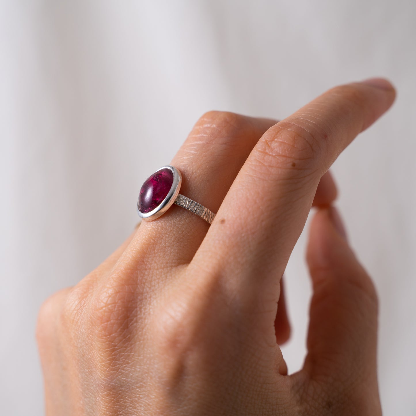 Handcrafted oval pink tourmaline cabochon silver textured ring