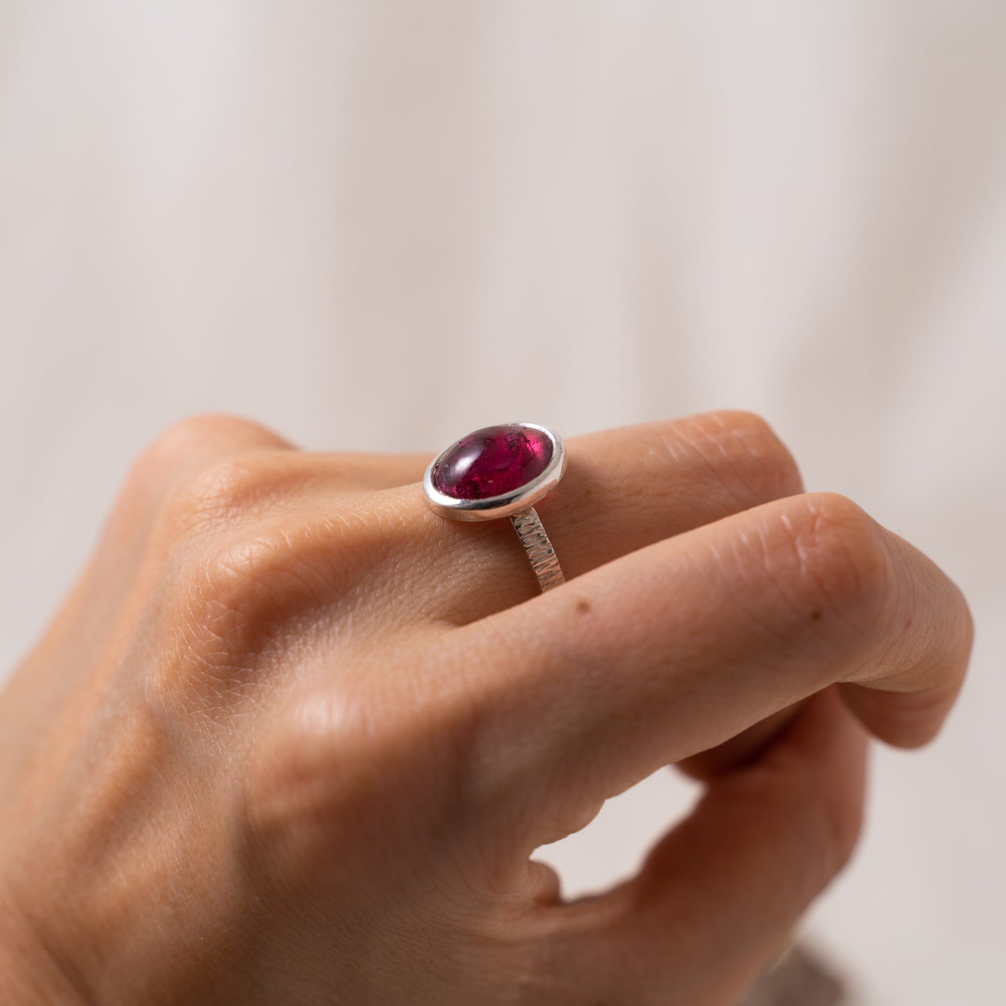 Handcrafted oval pink tourmaline cabochon silver textured ring