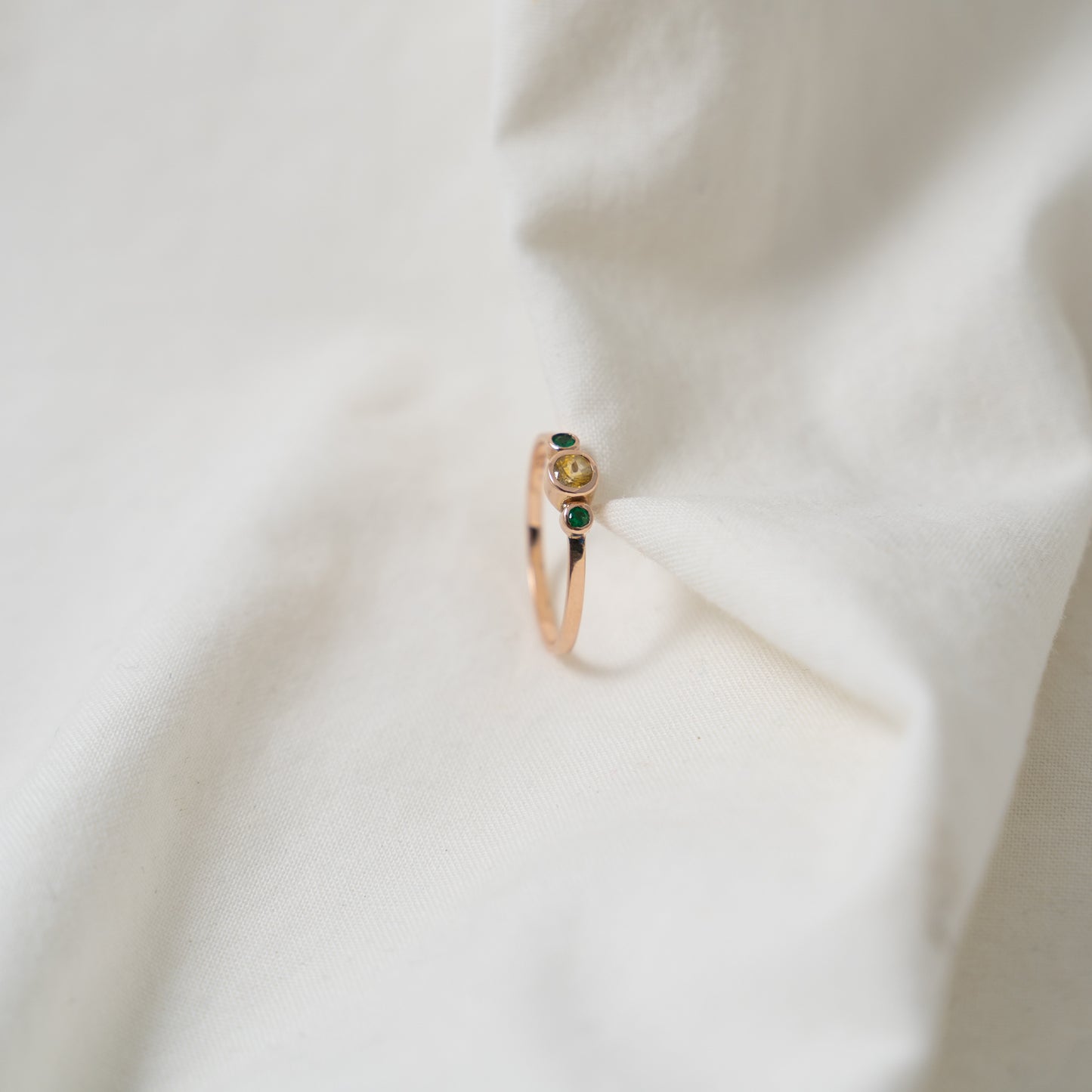 Taiga | Yellow sapphire and emerald rose gold ring