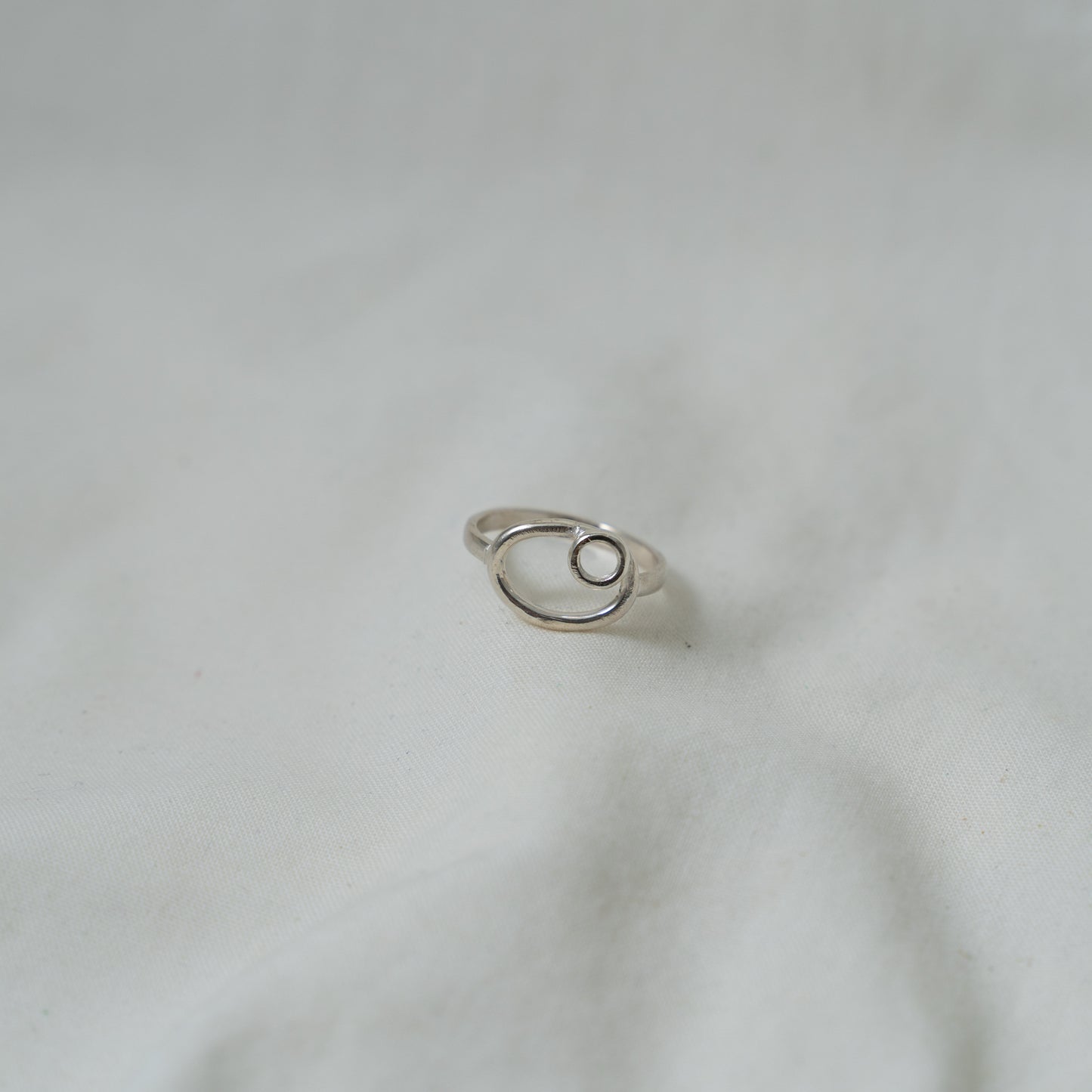 Dual oval and circle, small silver ring