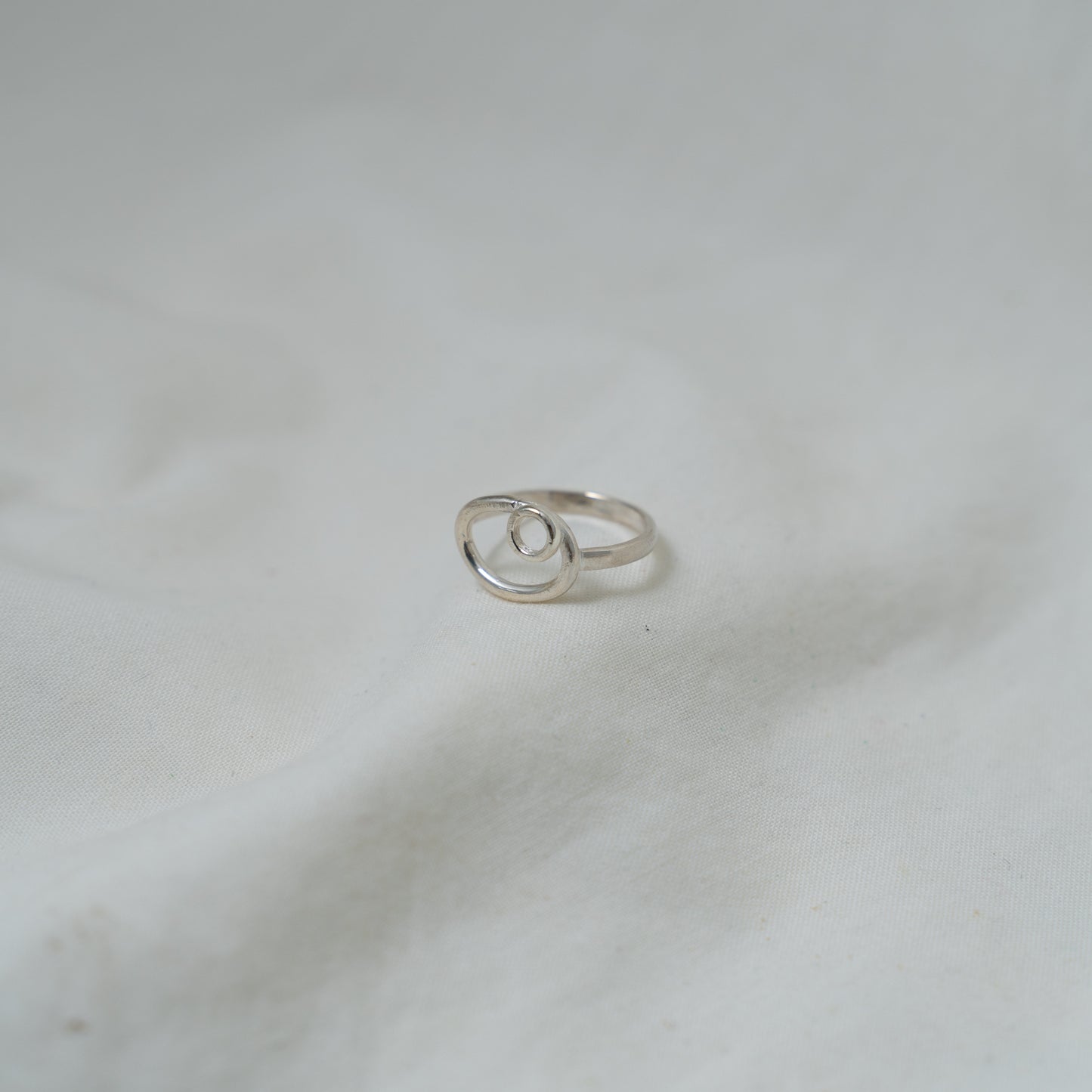 Dual oval and circle, small silver ring