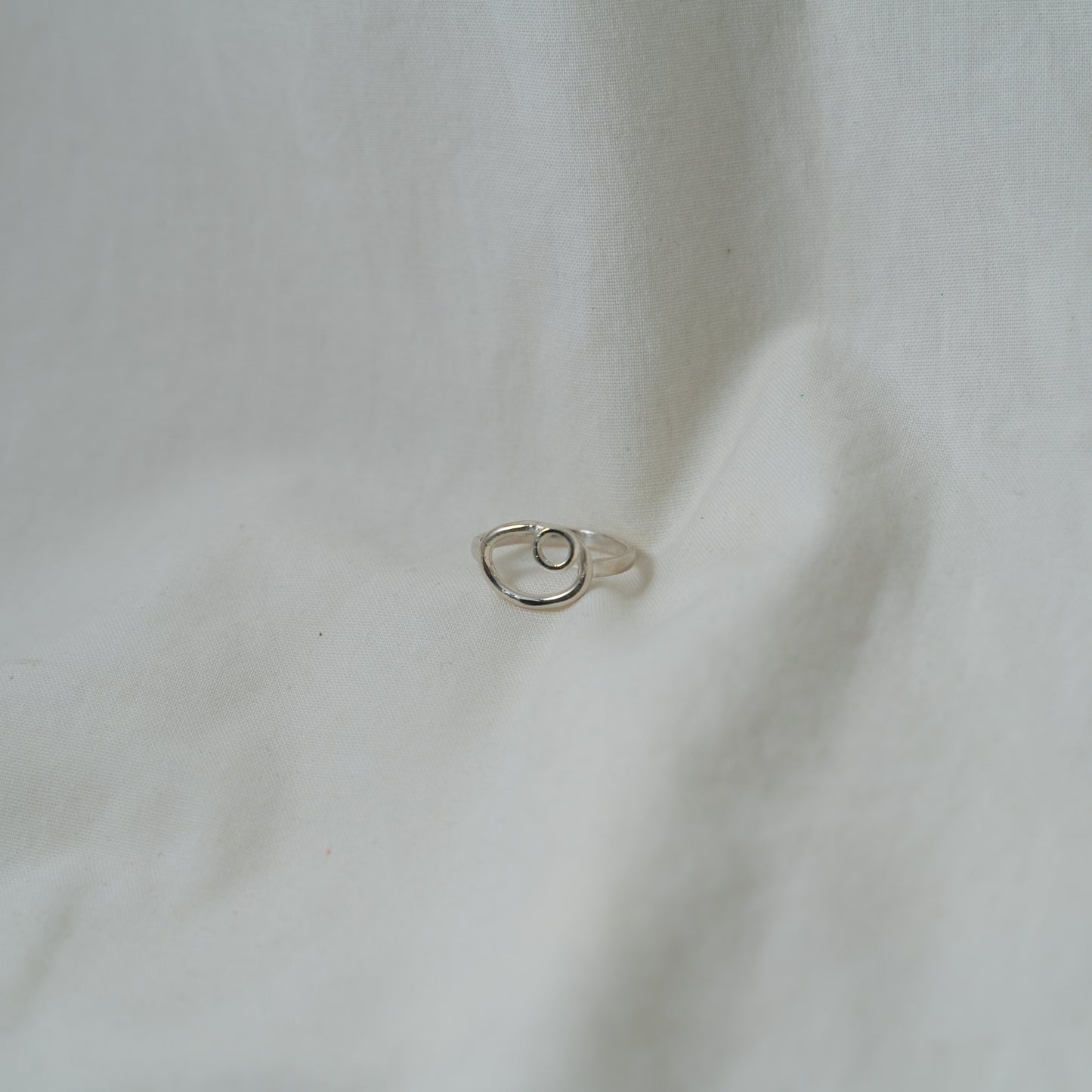 Dual oval and circle, small silver ring