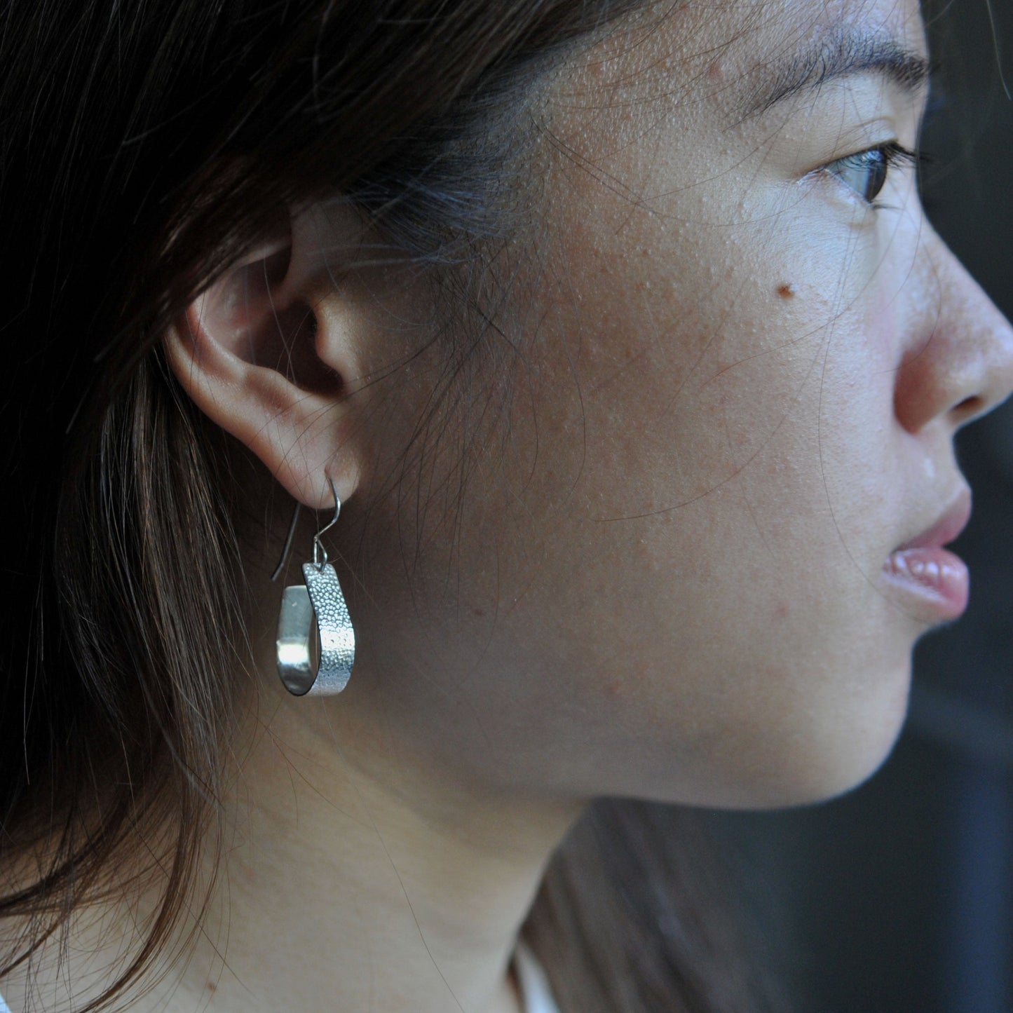 Bohemian with a hammered textured finish, silver, handcrafted open, teardrop, hoop earrings.