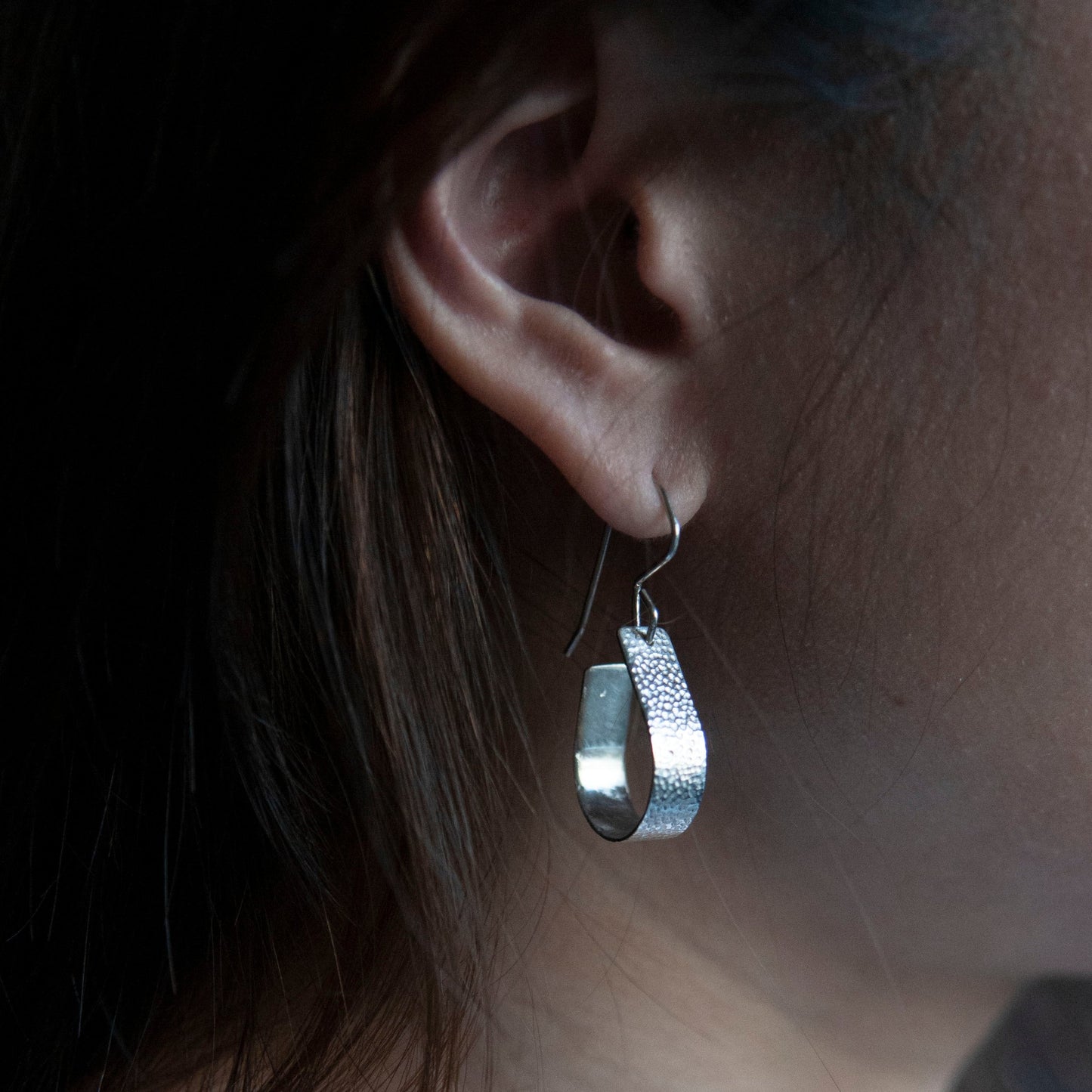 Bohemian with a hammered textured finish, silver, handcrafted open, teardrop, hoop earrings.