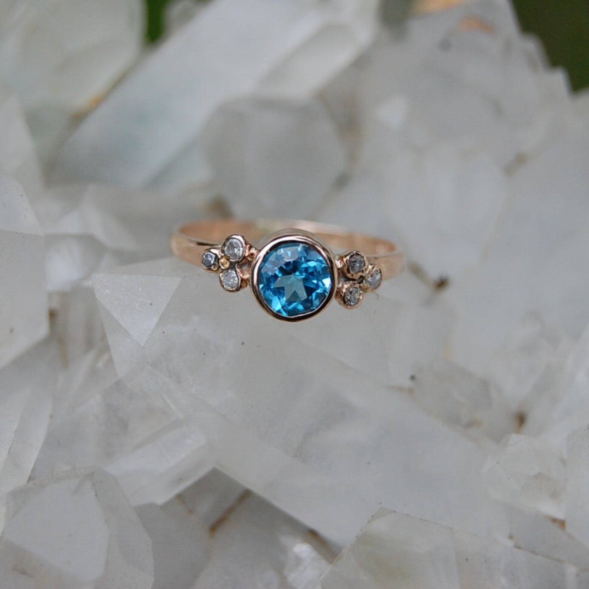 Diamond and double blue, brilliant cut aquamarine gold engagement ring.
