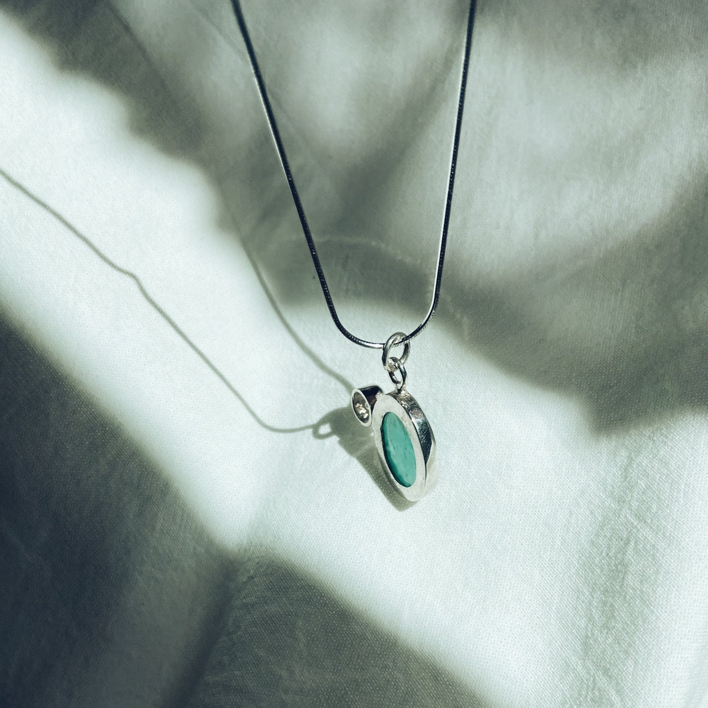 Turquoise and cubic Zirconia silver pendant