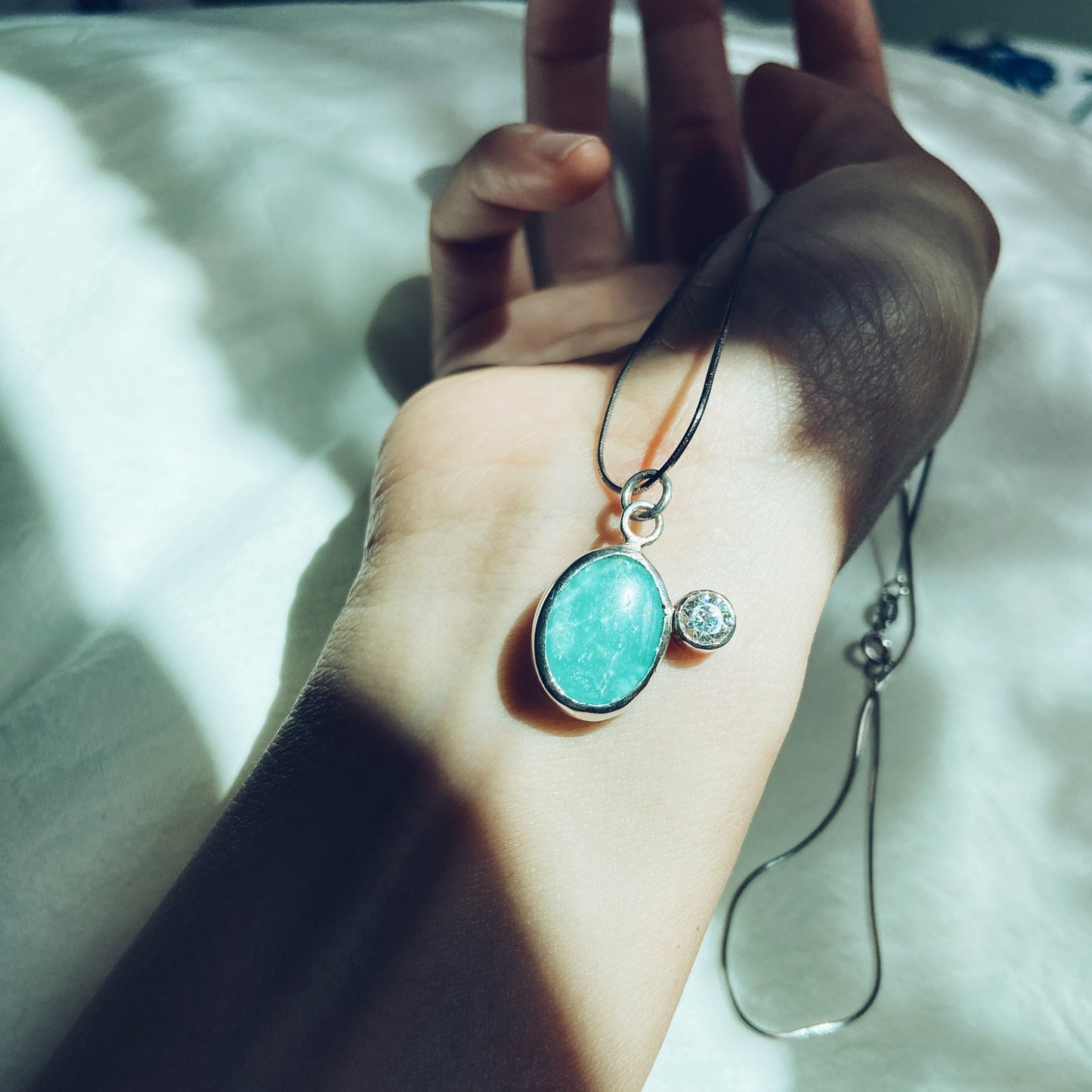 Turquoise and cubic Zirconia silver pendant