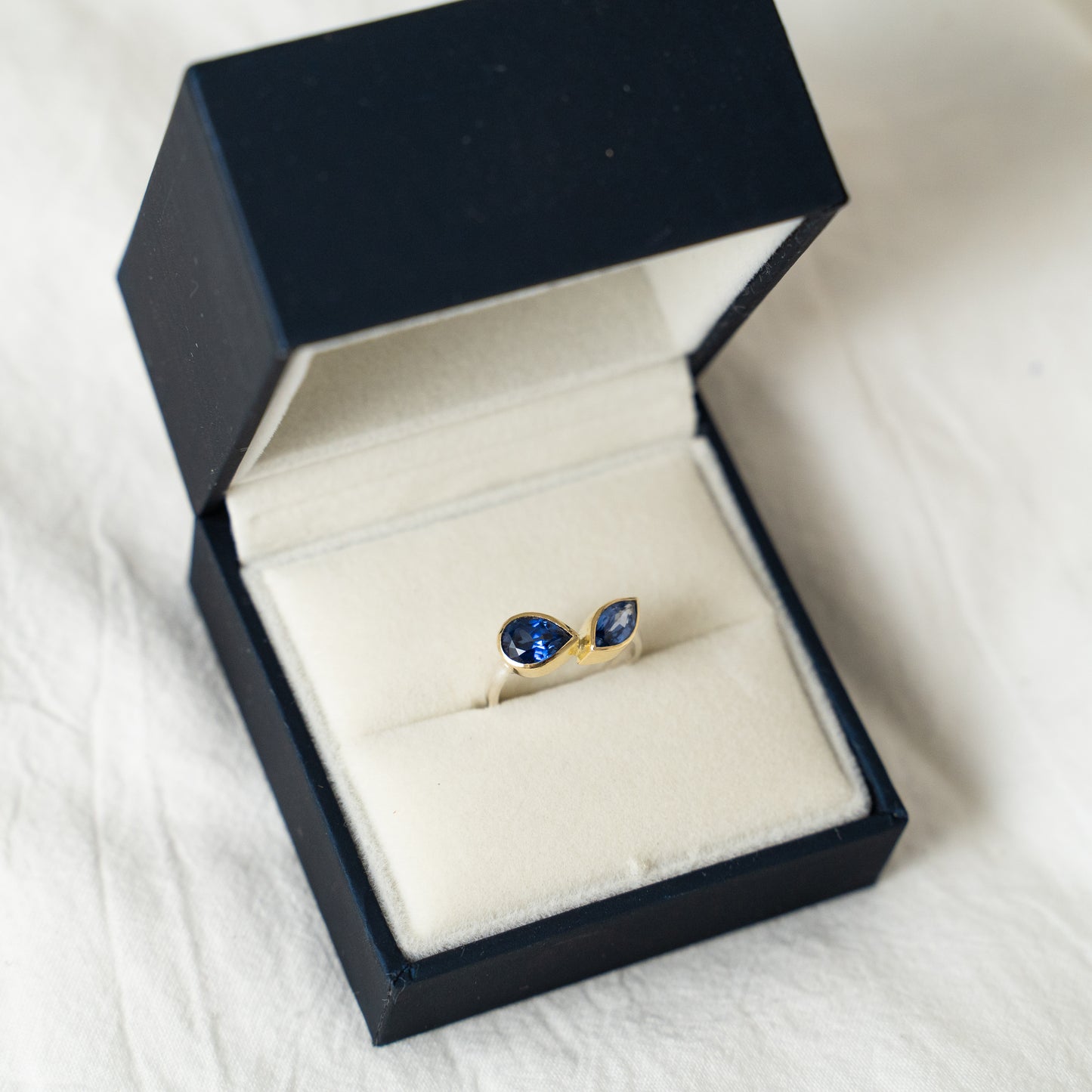 Toi et Moi double sapphire engagement ring in 18k gold and silver.
