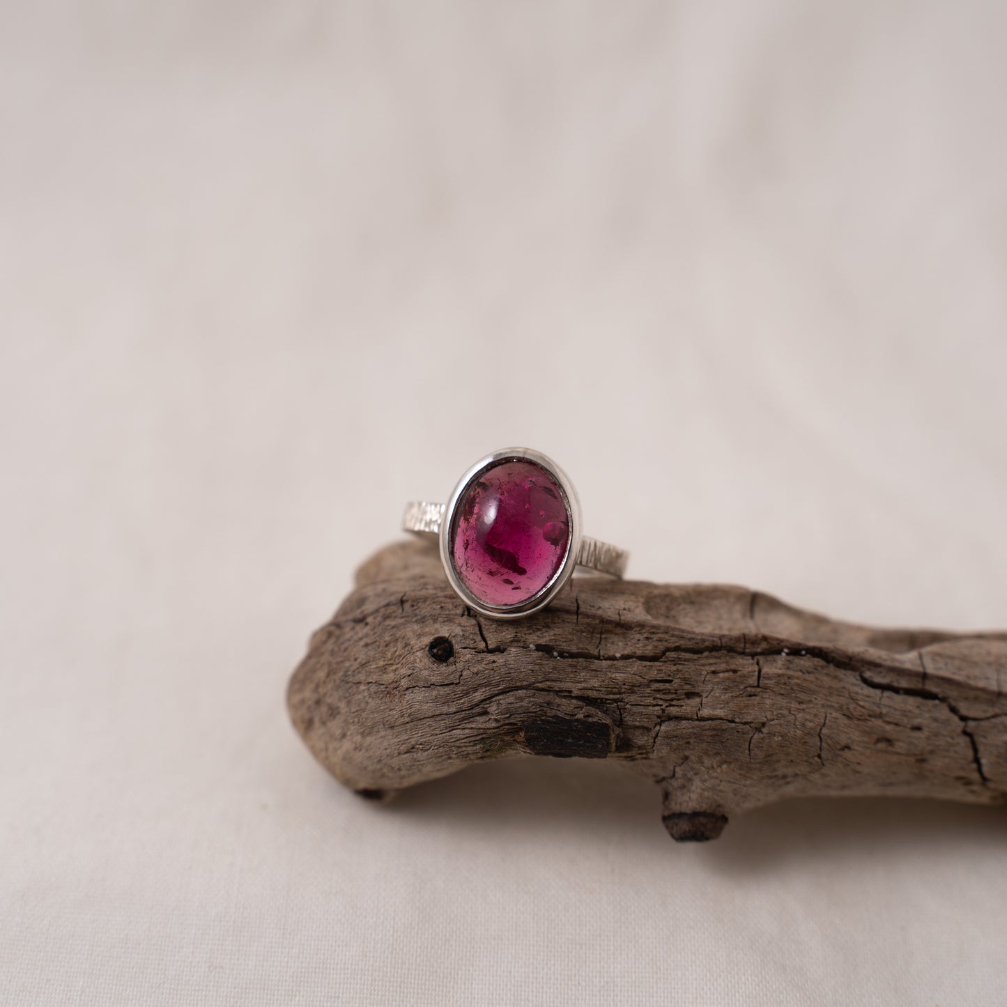 Oval pink tourmaline cabochon silver textured ring